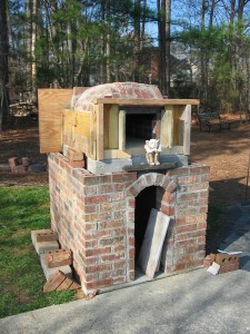 Oven front with gargoyle guardian